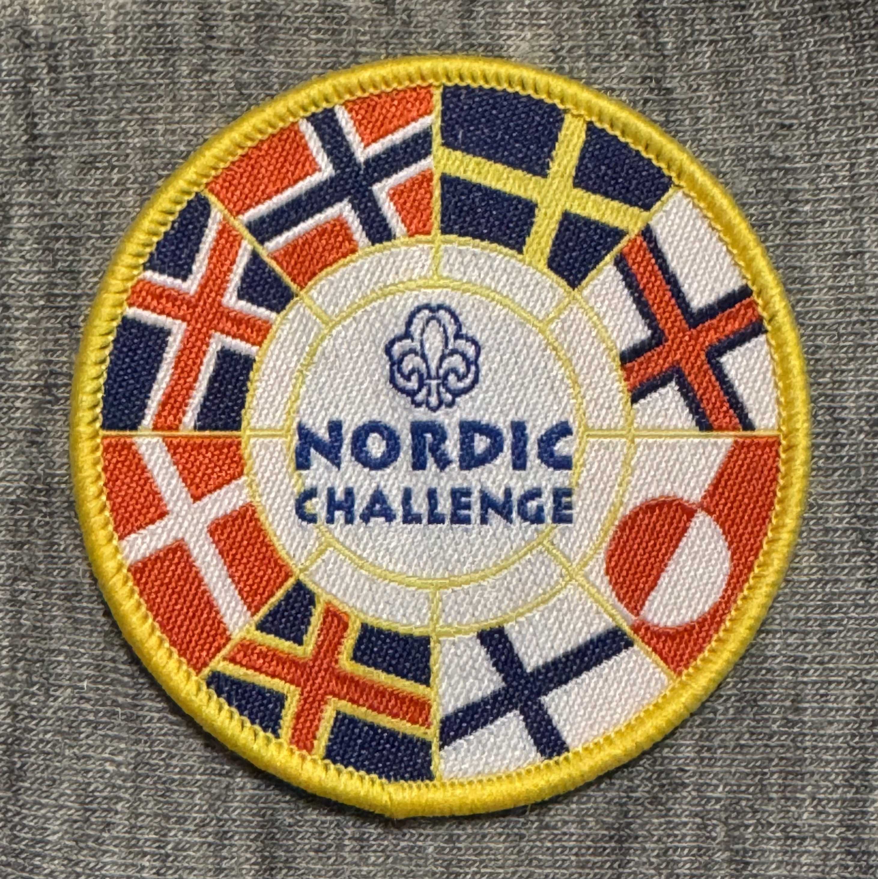Nordic Challenge Man skal besøge de nordiske lande - inkl Færøerne, Grønland og Ålandsøerne. Besøget skal være i spejderregi - landslejr, tur med gruppen, rejse med spejderrejser og i uniform og/eller tørklæde. Be-søg markeres med et lille kryds under flaget.